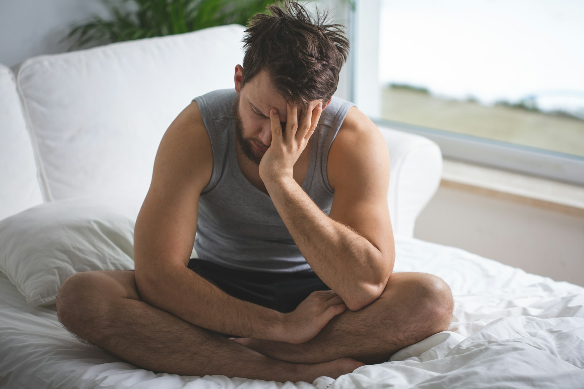 Worried man in bed